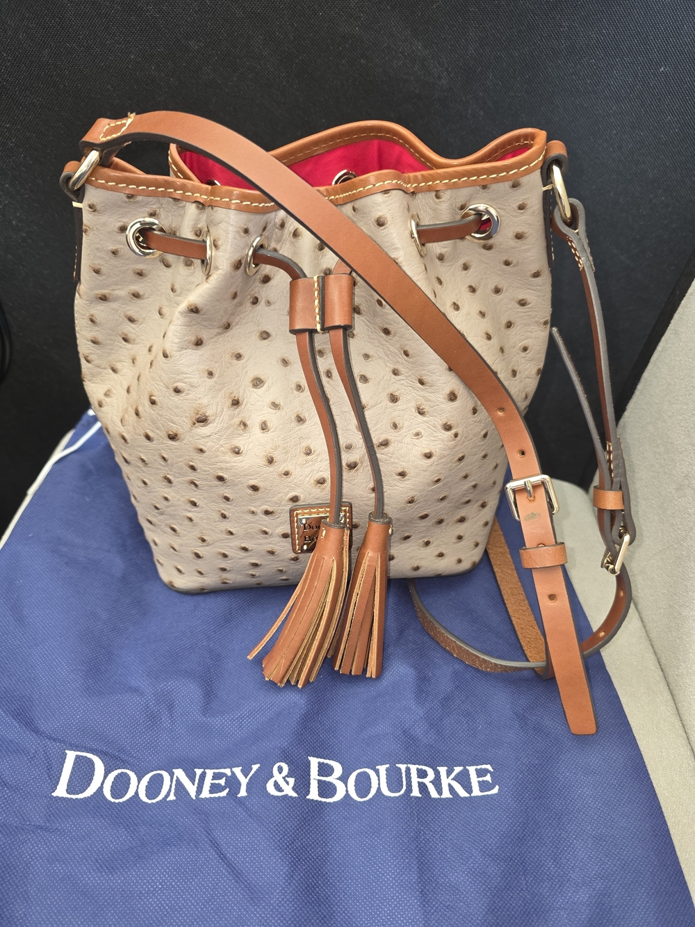 Dooney & Bourke Beige Ostrich-Embossed Bucket Crossbody with Tan Trim